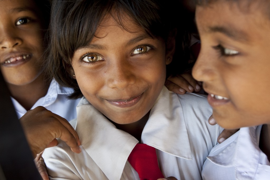 Portrait of children at Dharmarama Kanishta Vidyalaya School in Ahangama, Sri Lanka. This school opened November 2006 and is one of 20 schools built through the Schools Re-Awaken project. The Schools Re-Awaken project rebuilt schools destroyed by the Dec. 26, 2004 tsunami. The tsunami killed 30,196 people and displaced 850,201 in Sri Lanka alone. The project is sponsored by District 3220, the Rotary Foundation, Standard Chartered Bank and many other contributors. The land was donated by the local Buddhist temple.